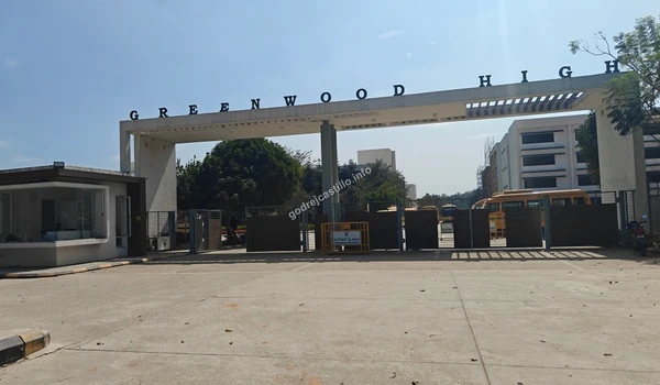 Street view capturing the Greenwood High archway, ensuring that children living in Godrej Castillo have access to great local schools