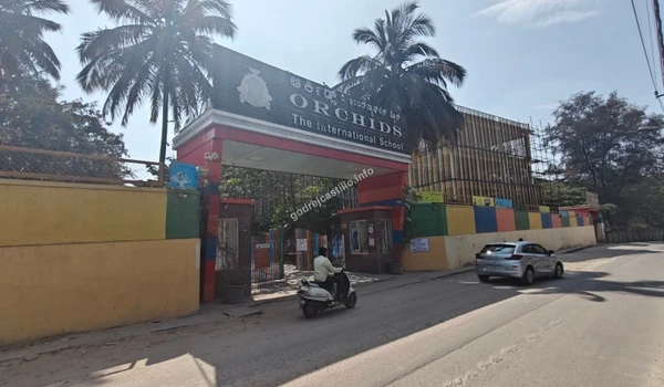 Street perspective of Orchids The International School showing the surrounding neighborhood and easy commute from Godrej Castillo