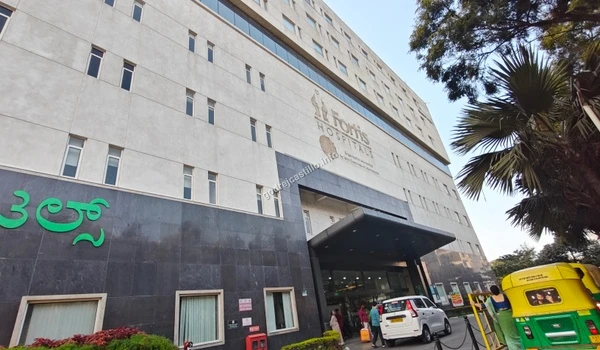 Upward exterior view of the Fortis Hospitals building, a major multi-specialty healthcare center easily reachable from Godrej Castillo.