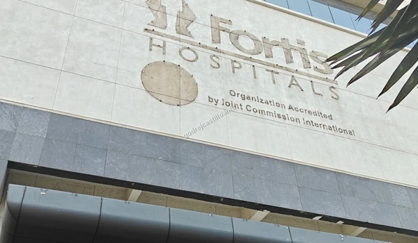 Detailed view of the Fortis Hospitals logo and Joint Commission International accreditation sign close to Godrej Castillo.