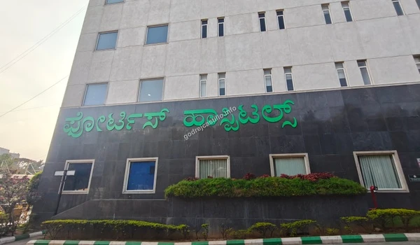 Ground floor view of the Fortis Hospitals building emphasizing its scale and proximity to the Godrej Castillo project.