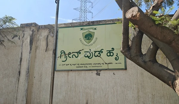 Close up of the Greenwood High school signboard in English and Kannada, a prominent landmark adjacent to the Godrej Castillo property