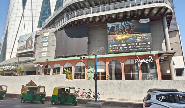 Closer view of the vibrant cafes and eateries at the ground level of Nexus Vega City mall, enhancing the neighborhood appeal of Godrej Castillo.
