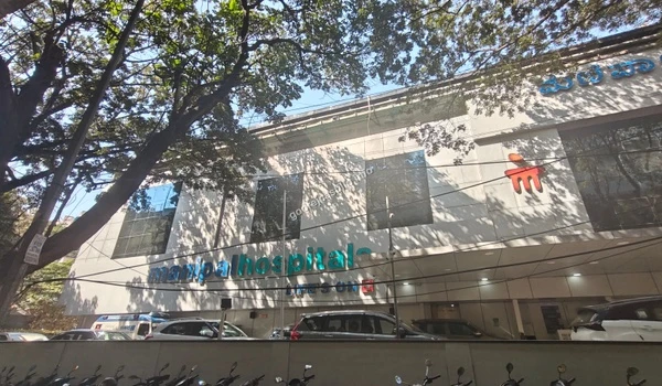 Sunlit exterior of Manipal Hospitals offering premium medical treatments for the residents of Godrej Castillo.