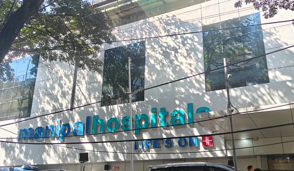 Wide shot of the Manipal Hospitals building showing the scale of the healthcare infrastructure close to Godrej Castillo.