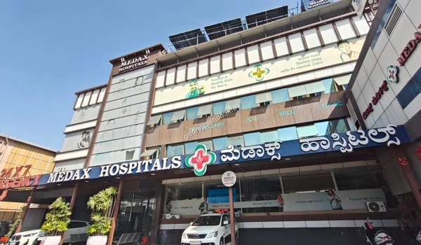 View of Medax Hospitals including the 24/7 emergency entrance, offering reliable healthcare close to Godrej Castillo.