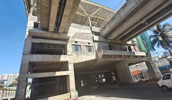 Close up view of the massive concrete pillars and structural framework of the new metro station being built near Godrej Castillo