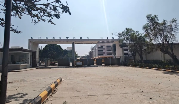 A clear view of the Greenwood High campus gate, highlighting the excellent schooling options available just minutes from Godrej Castillo
