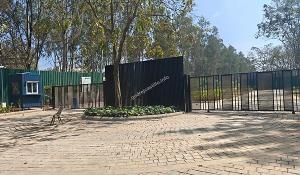 View of the secure primary access point at Godrej Castillo with professional security cabins and elegant perimeter fencing for resident safety