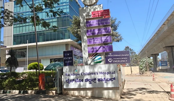 Entrance signboard of Rainbow Children's Hospital offering specialized pediatric and maternal care near Godrej Castillo.