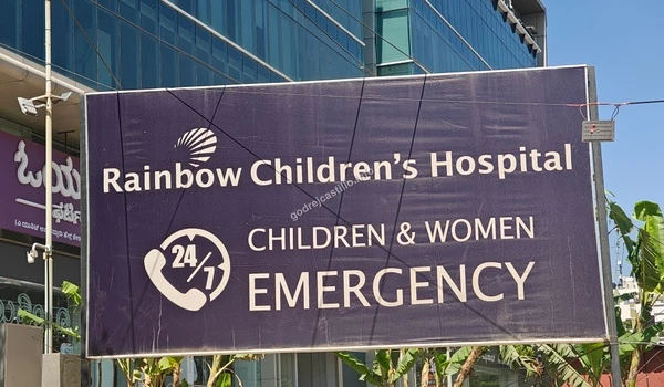 Close-up of the 24/7 Children and Women Emergency sign at Rainbow Children's Hospital near Godrej Castillo.