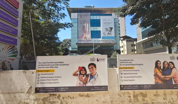 Promotional hoarding displaying pediatric surgery expertise at Rainbow Children's Hospital near Godrej Castillo.
