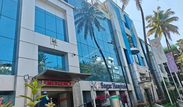 Emergency drop-off and front entrance of Sagar Hospitals offering vital medical services near Godrej Castillo.