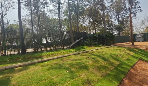 The secure perimeter fencing of Godrej Castillo highlighting the project's focus on safety and privacy for residents