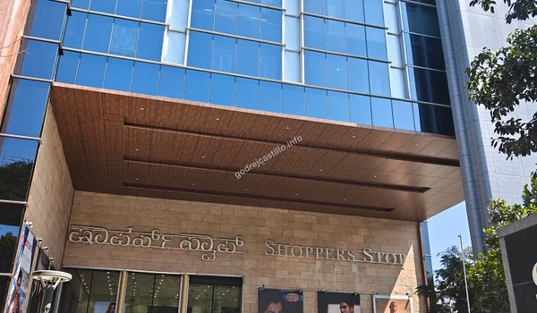 Grand exterior of the Shoppers Stop outlet situated in a modern commercial complex, serving the premium lifestyle needs of Godrej Castillo residents